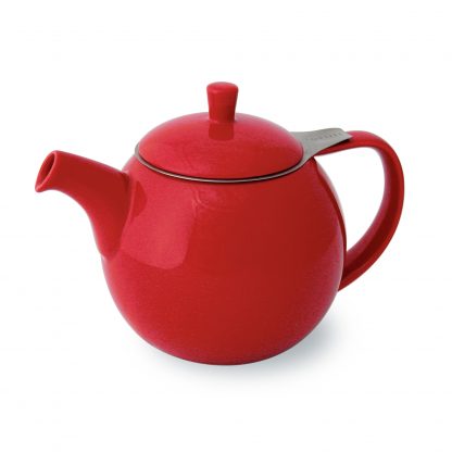 Bright red round teapot with curved spout and handle, lid with post handle, and stainless steel infuser basket with handle extending outside the lid on white background