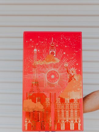 Advent Calendar colored red with gold foil images depicting monuments