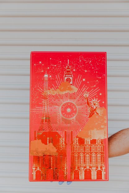 Advent Calendar colored red with gold foil images depicting monuments